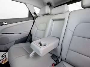 Rear seat leather armrest/cup ohlder - folded down
