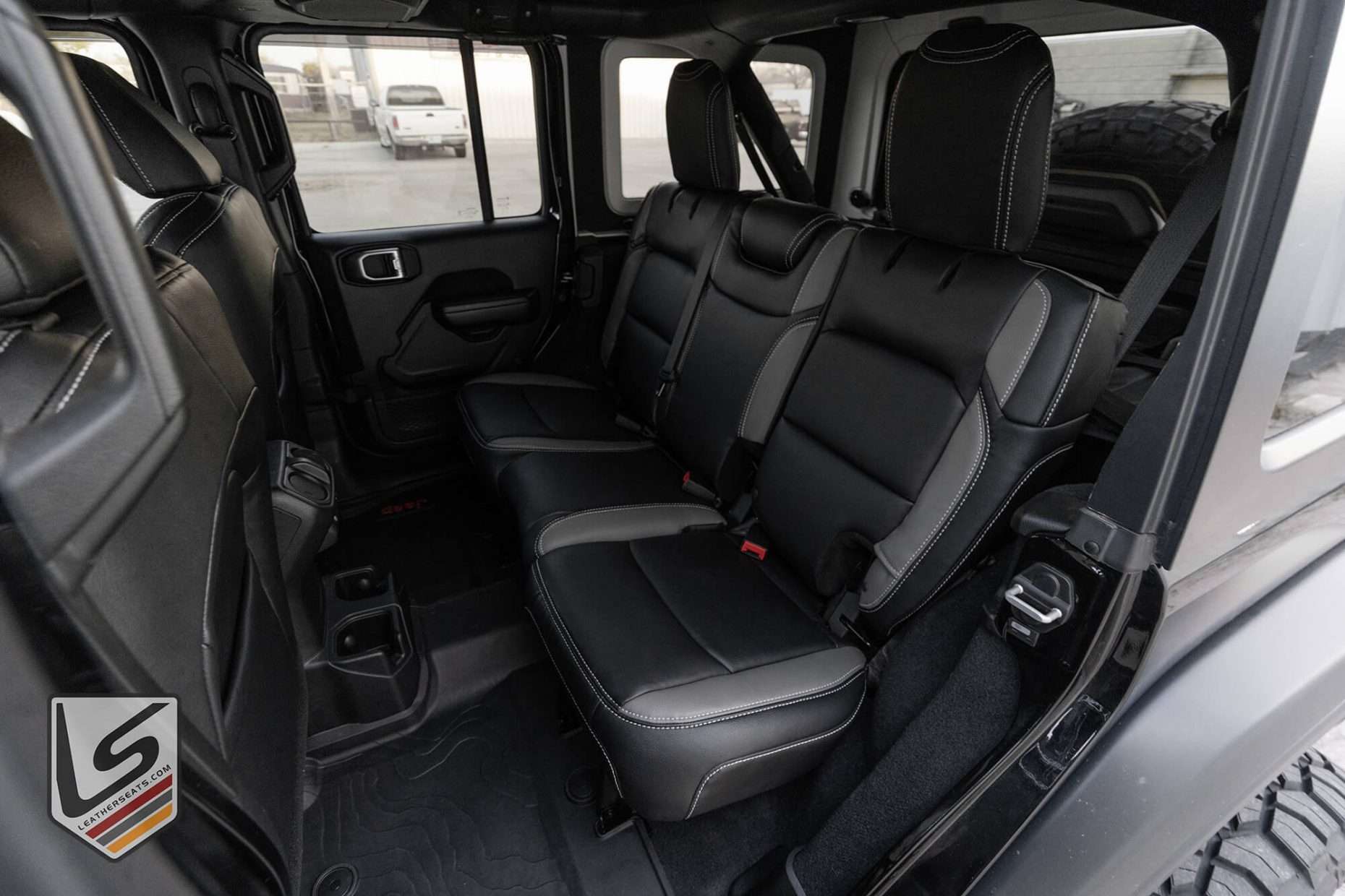 2018-2022 Jeep Wrangler JL installed Black and Light Grey leather seats - Rear seats from driver side
