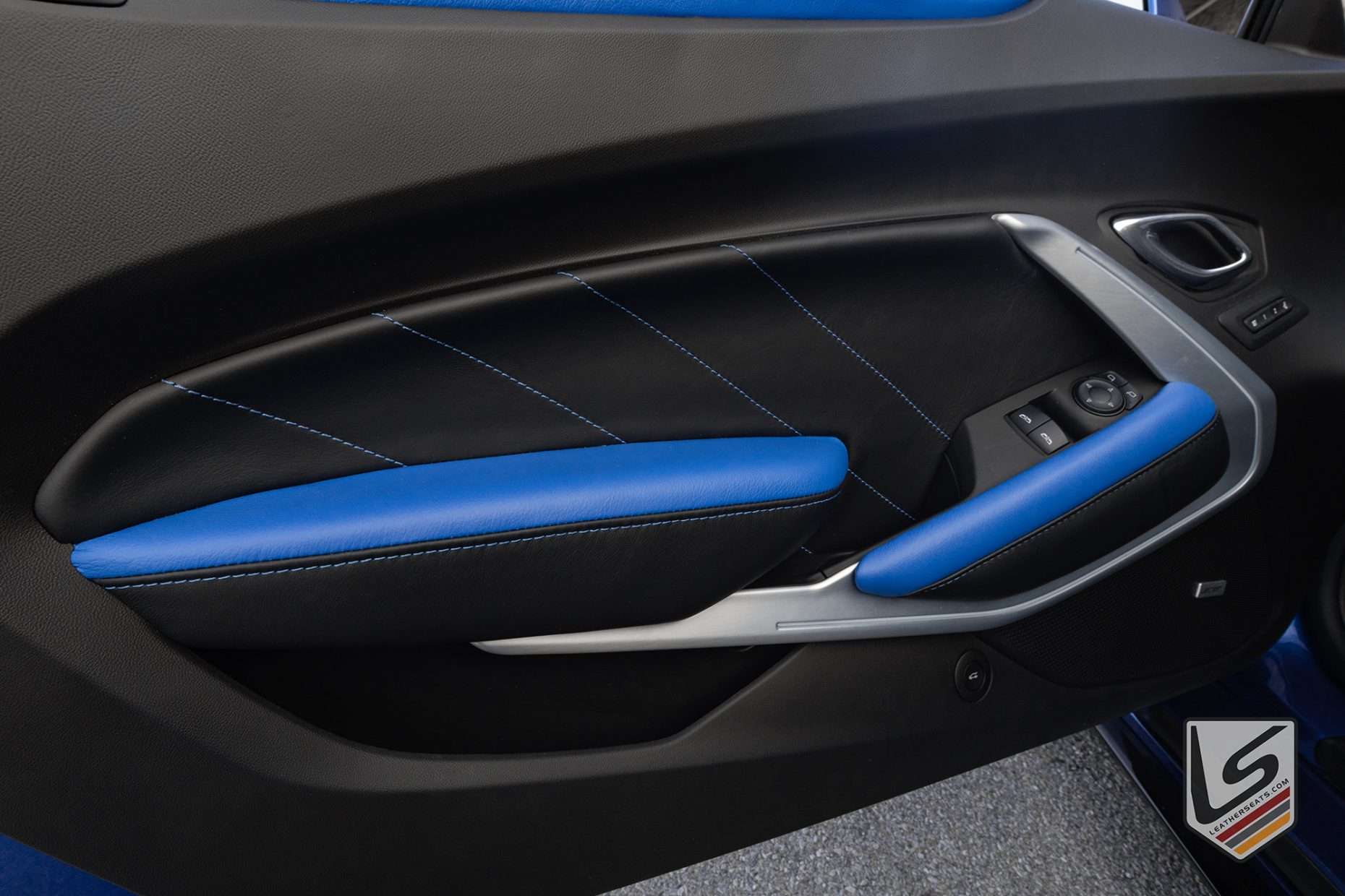 Black and Cobalt custom leather door insert and armrest close-up
