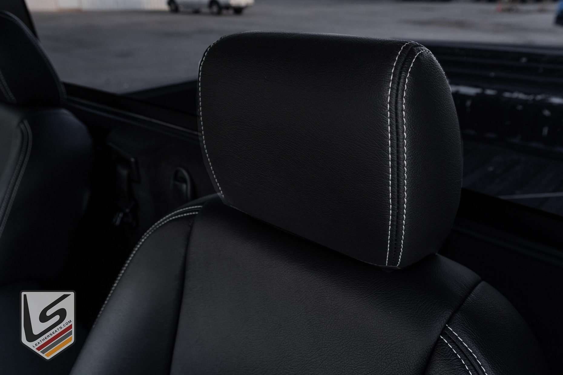 Dodge Ram leather headrest close-up with contrasting White stitching