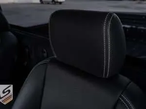 Dodge Ram leather headrest close-up with contrasting White stitching