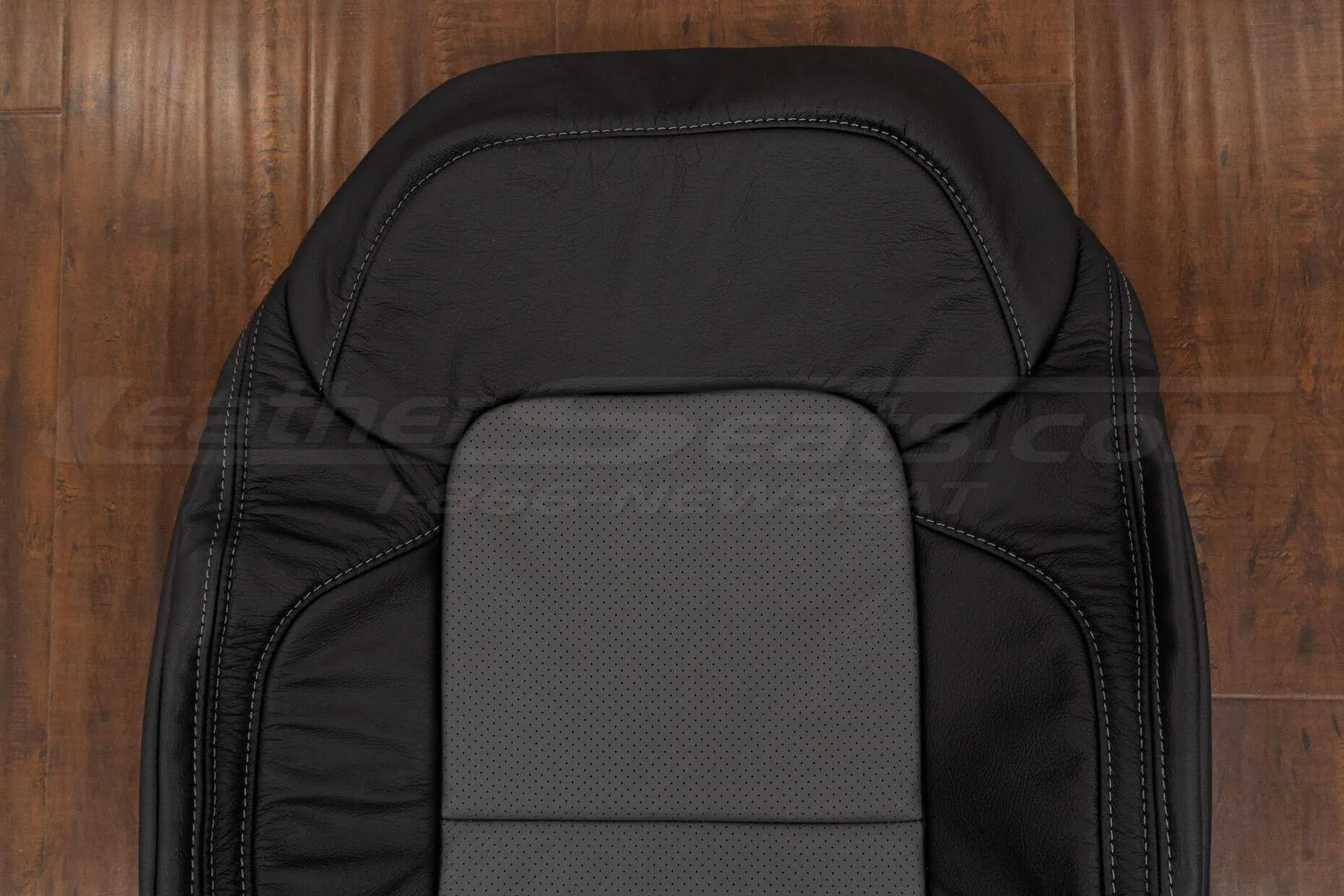 Upper section of front backrest with perforated inserts