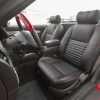2002-2005 Ford Thunderbird with installed leather seats in Ecstasy Black with Red stitching - Front driver seat