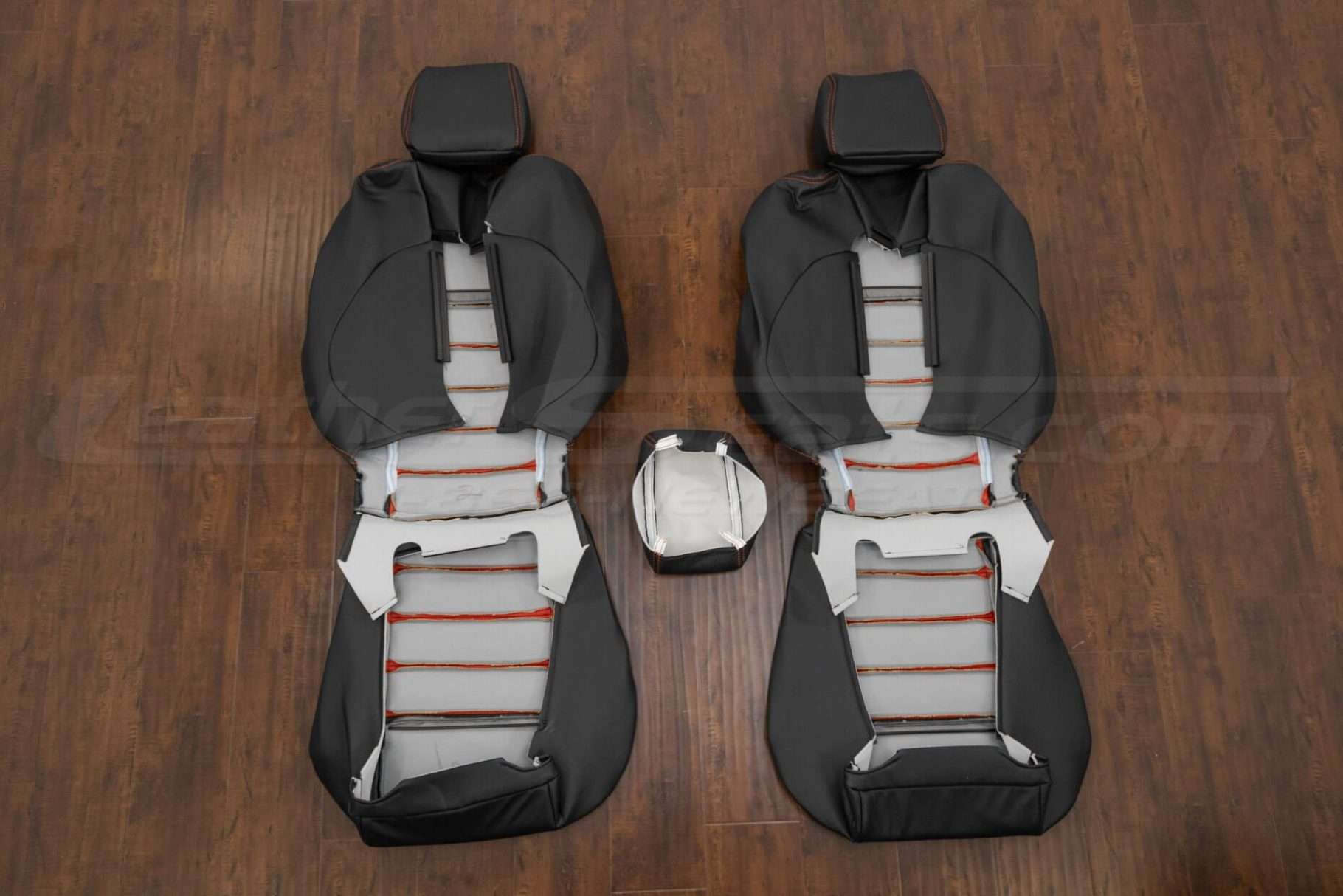 Back view of front seat upholstery & console lid cover