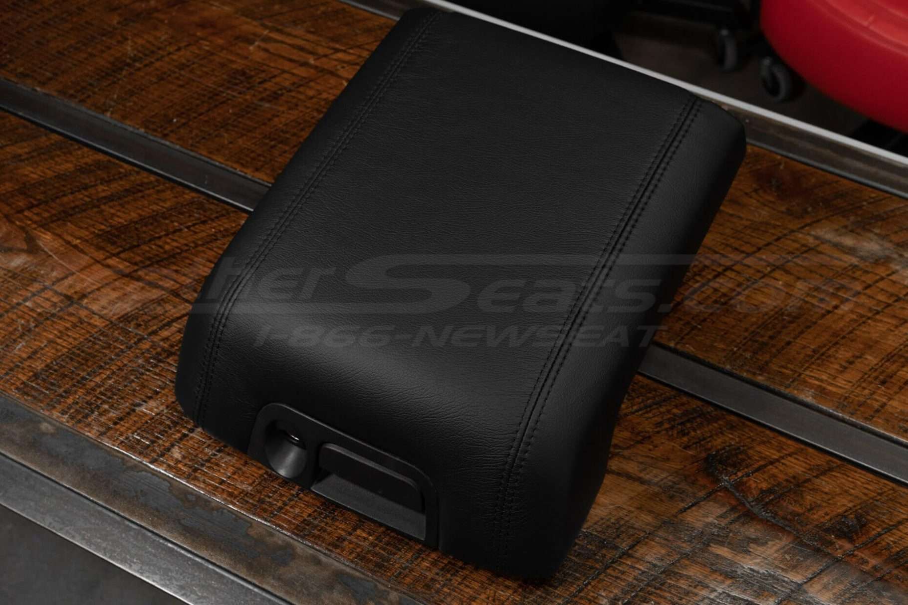 Alternate top-down view of console lid cover in Black