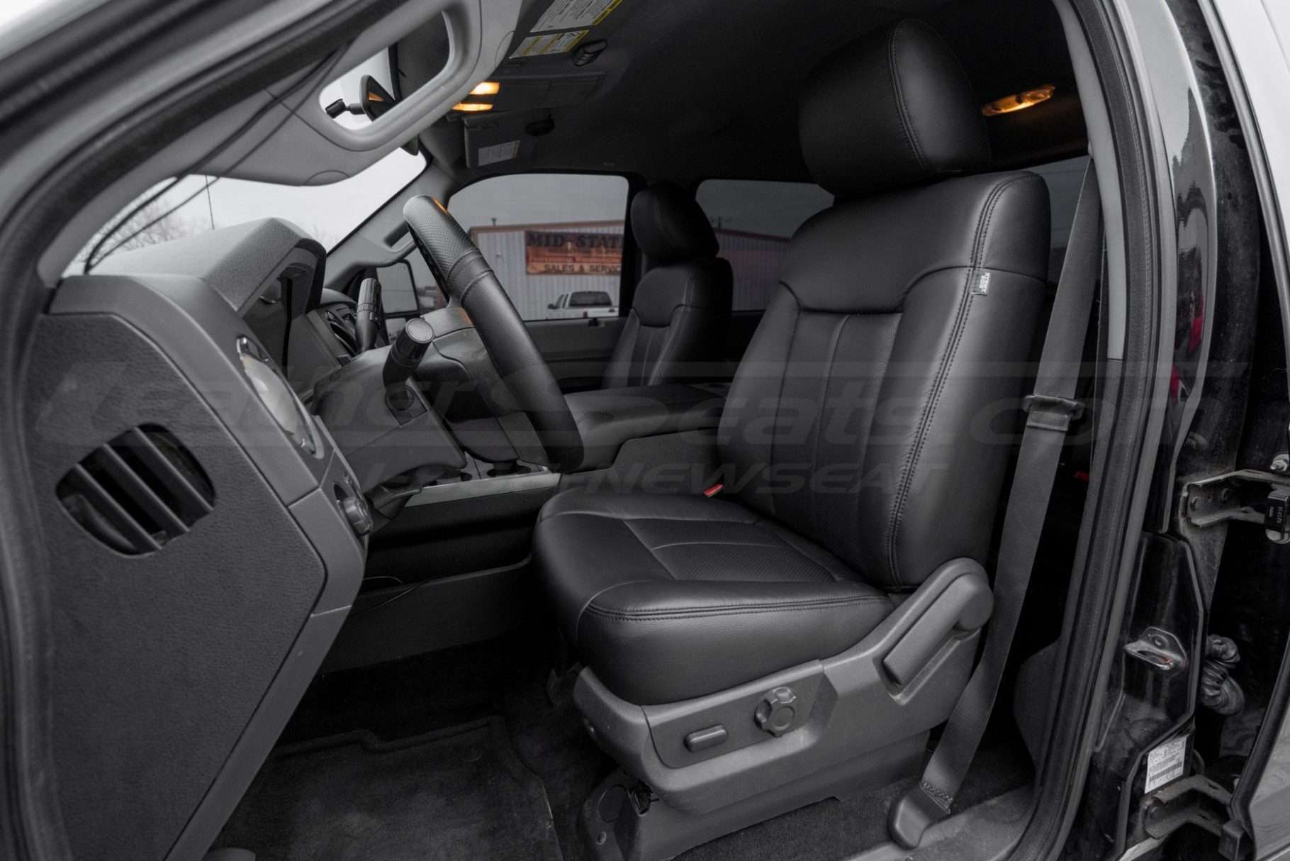 Hero shot of Ford SuperDuty with Black leather seats - Front driver