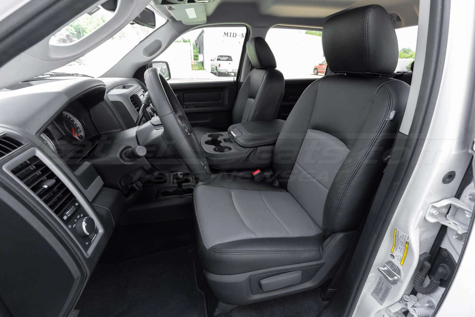 Two-Tone Dodge Ram leather seats in Black & Lapis - Front seat with middle seat down