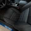 Top-down view of front driver seat installed with Blue Piazza Inserts