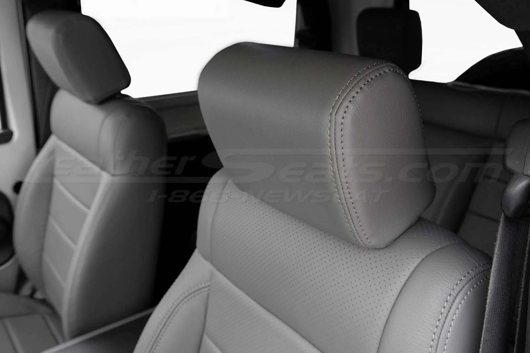 Leather headrest close-up with matching light grey stitching