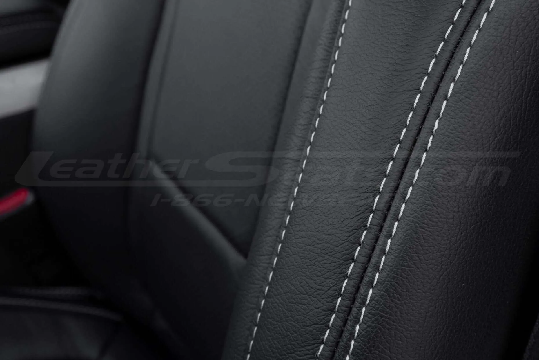 Black leather with contrasting silver double-stitching