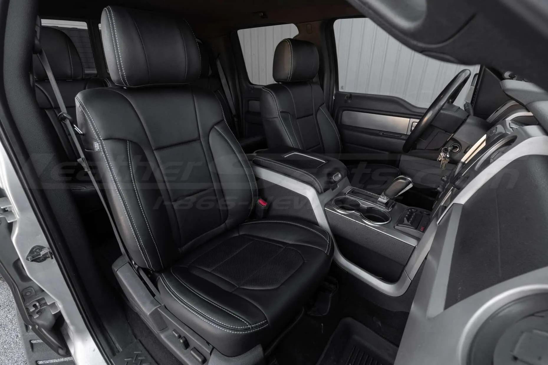 2012 Ford Raptor with Black leather seats and silver stitching - Front passenger