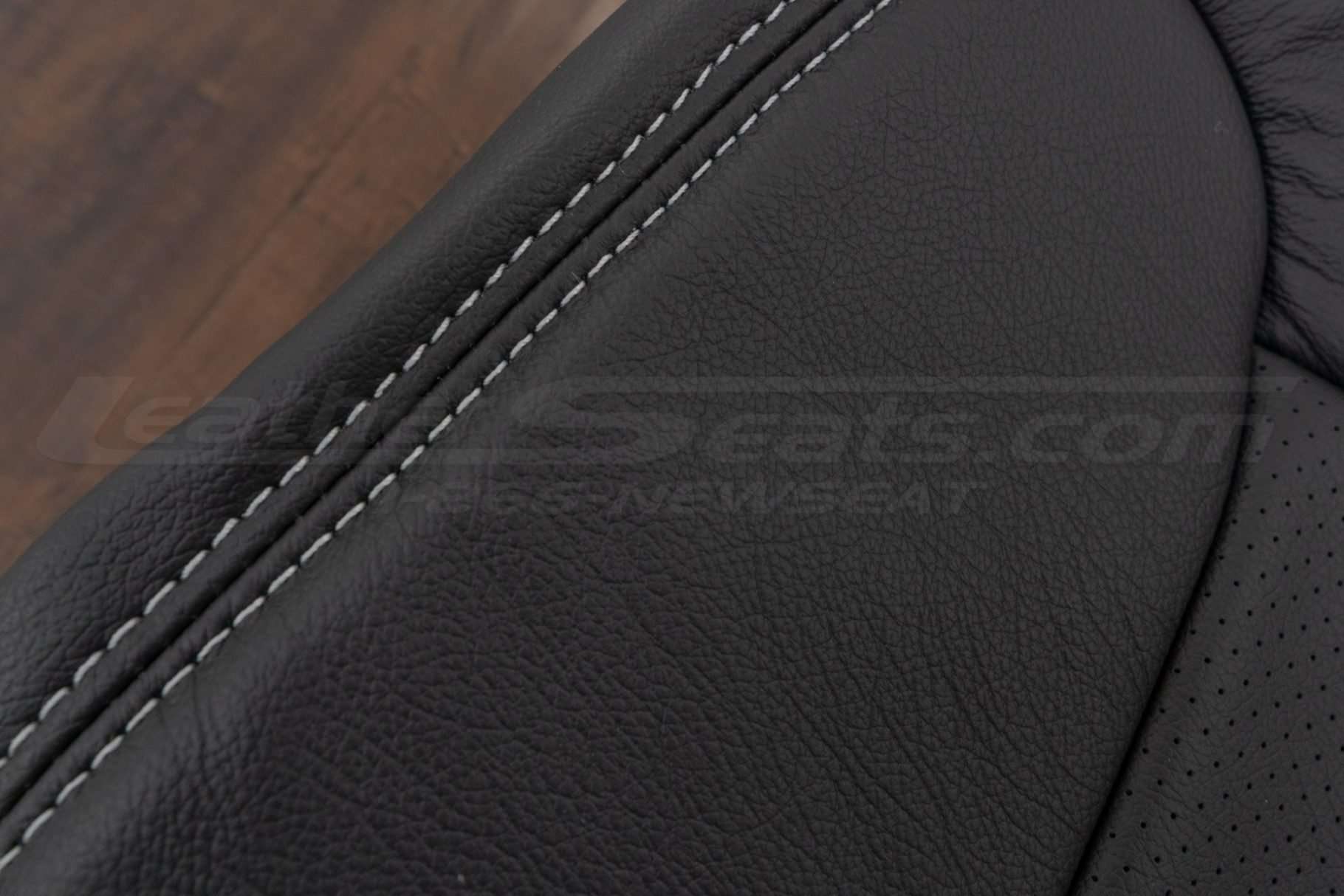 Contrasting Dove Grey double-stitching on Dark Graphite leather