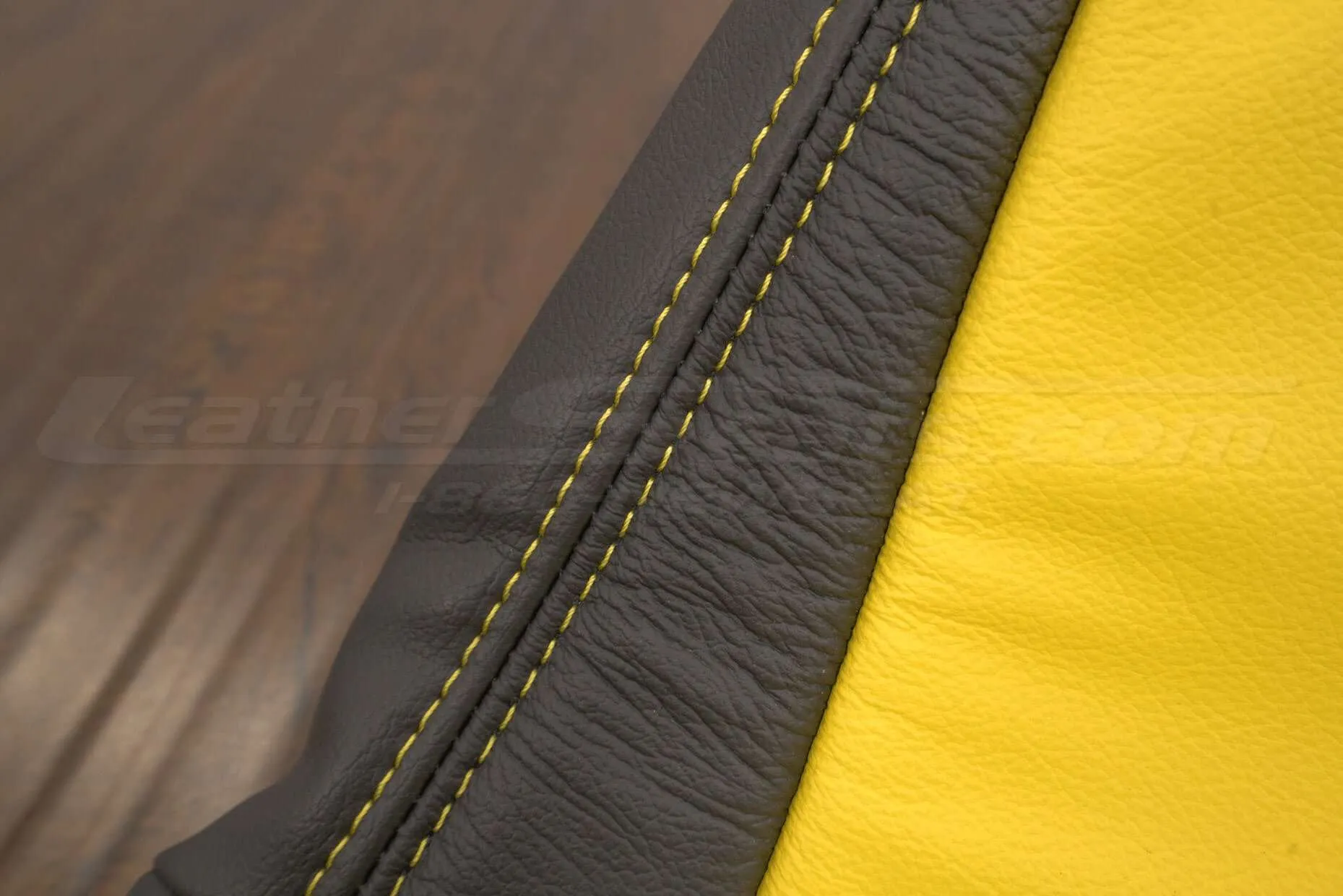 Contrasting Velocity Yellow stitching on Dark Graphite leather