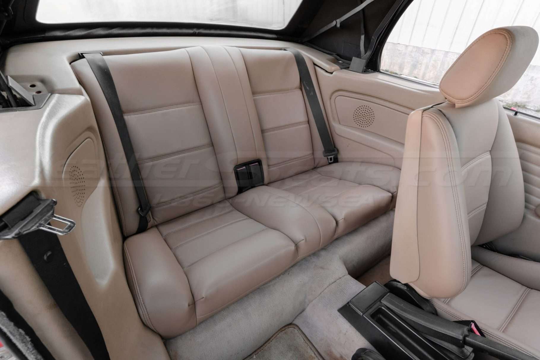 Installed leather rear seats in Nutmeg from passenger side