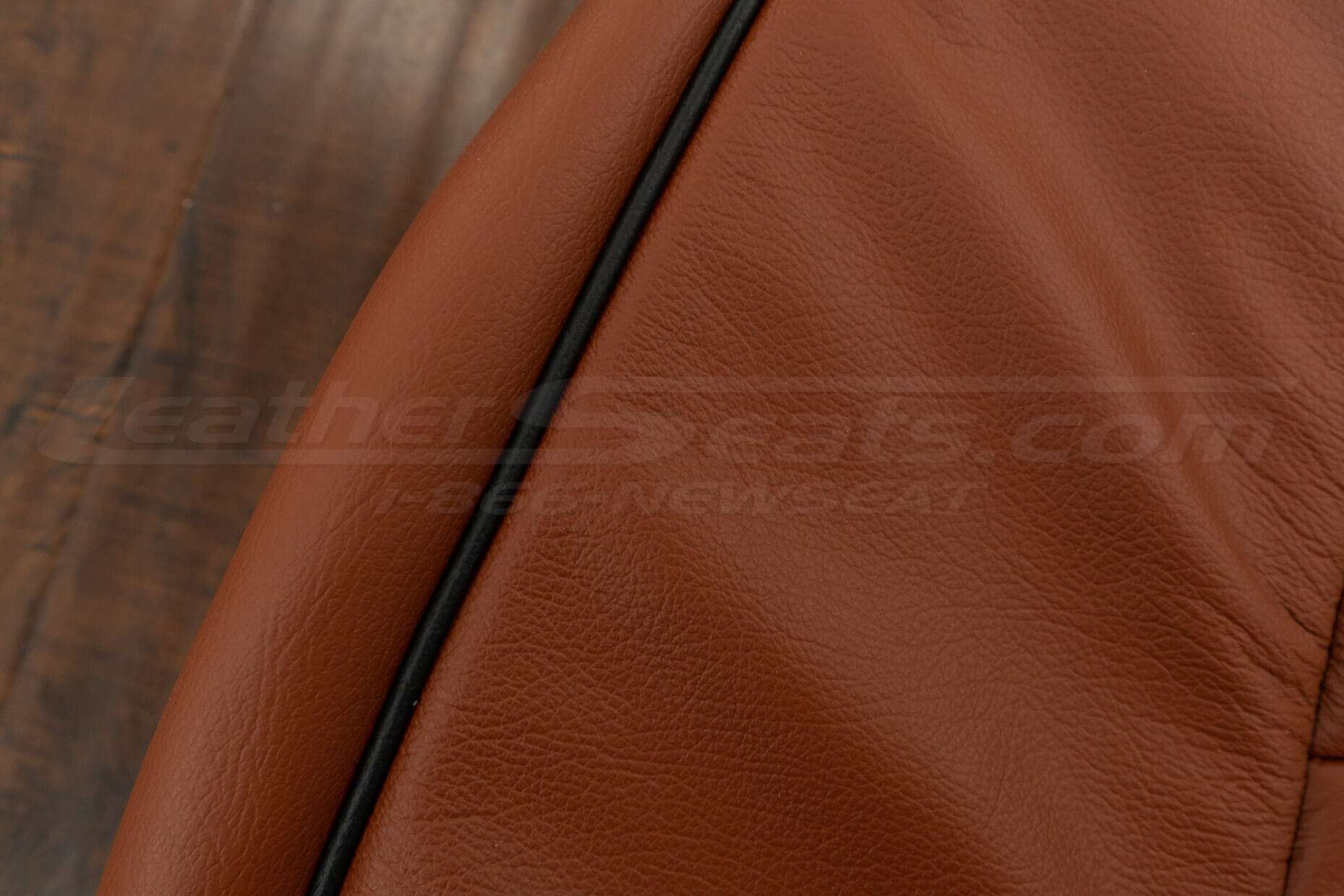 Contrasting Black Piping on Mitt Brown leather