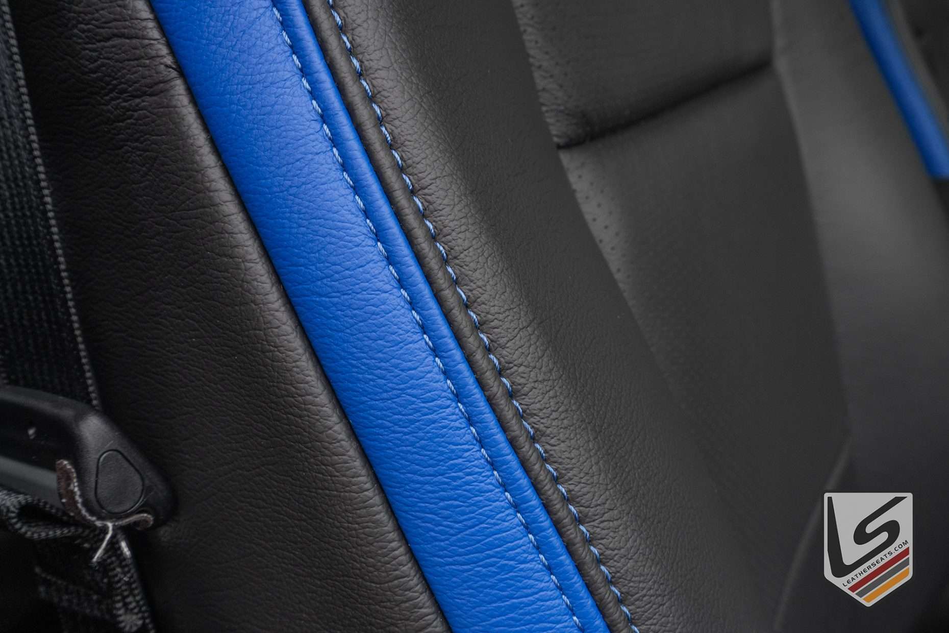 Contrasting Cobalt stitching on Dark Graphite leather