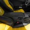 Black leather Corvette console with contrasting Velocity Yellow stitching