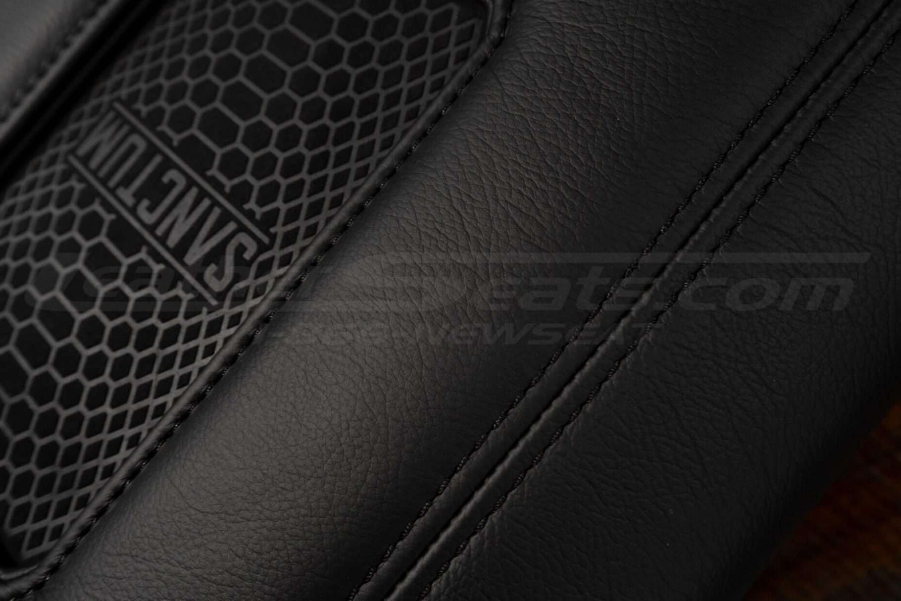 Matching Black double-stitching on Sanctum Wireless Phone Charging Console for Ford trucks