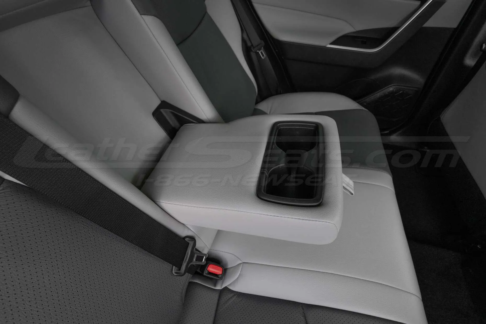 Rear seat leather armrest/cup holder