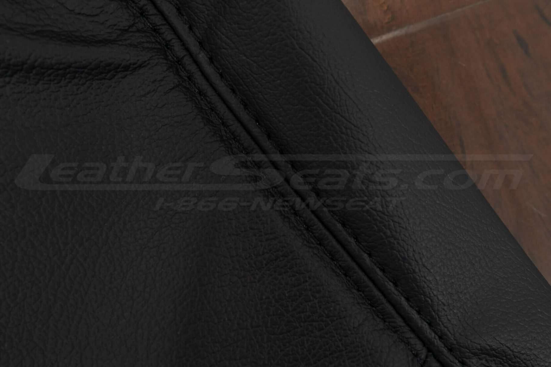 Black double-stitching on Black leather