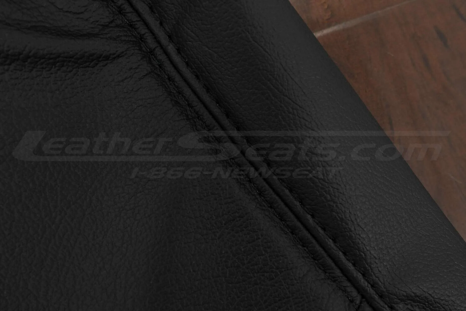 Black double-stitching on Black leather