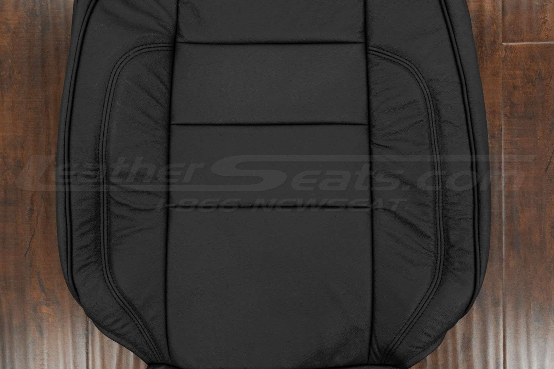 Black insert section of leather backrest uphosltery
