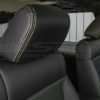 Black headrest close-up with contrasting Lime Green Thread