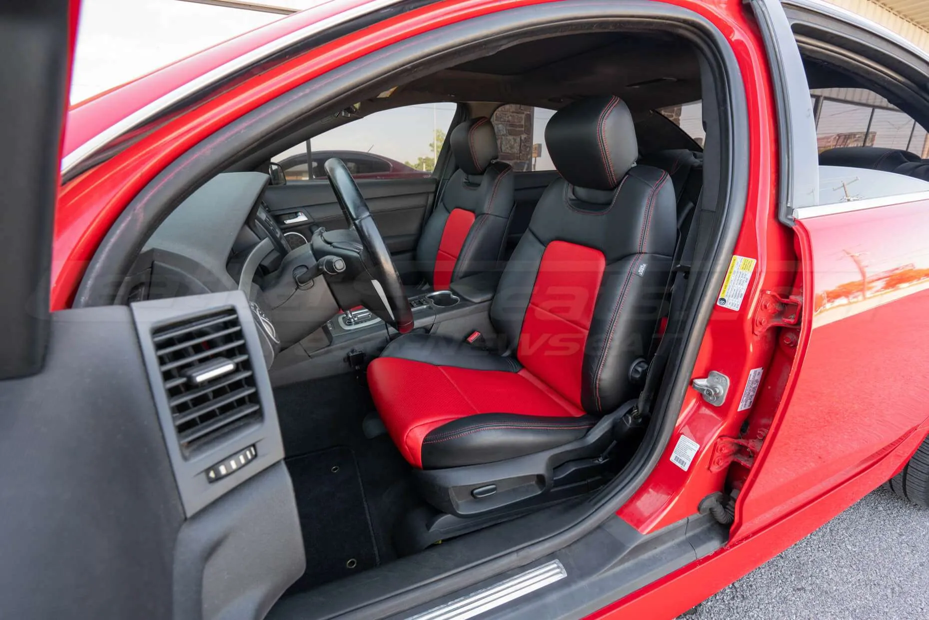 2009 Pontiac G8 with Black and Red leather seats with perforated combo and bright red stitching