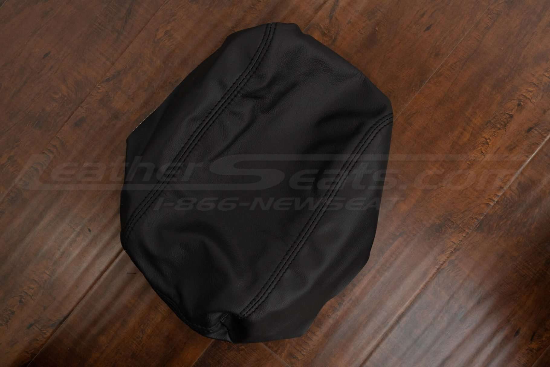 Alternate side view of black leather console lid cover