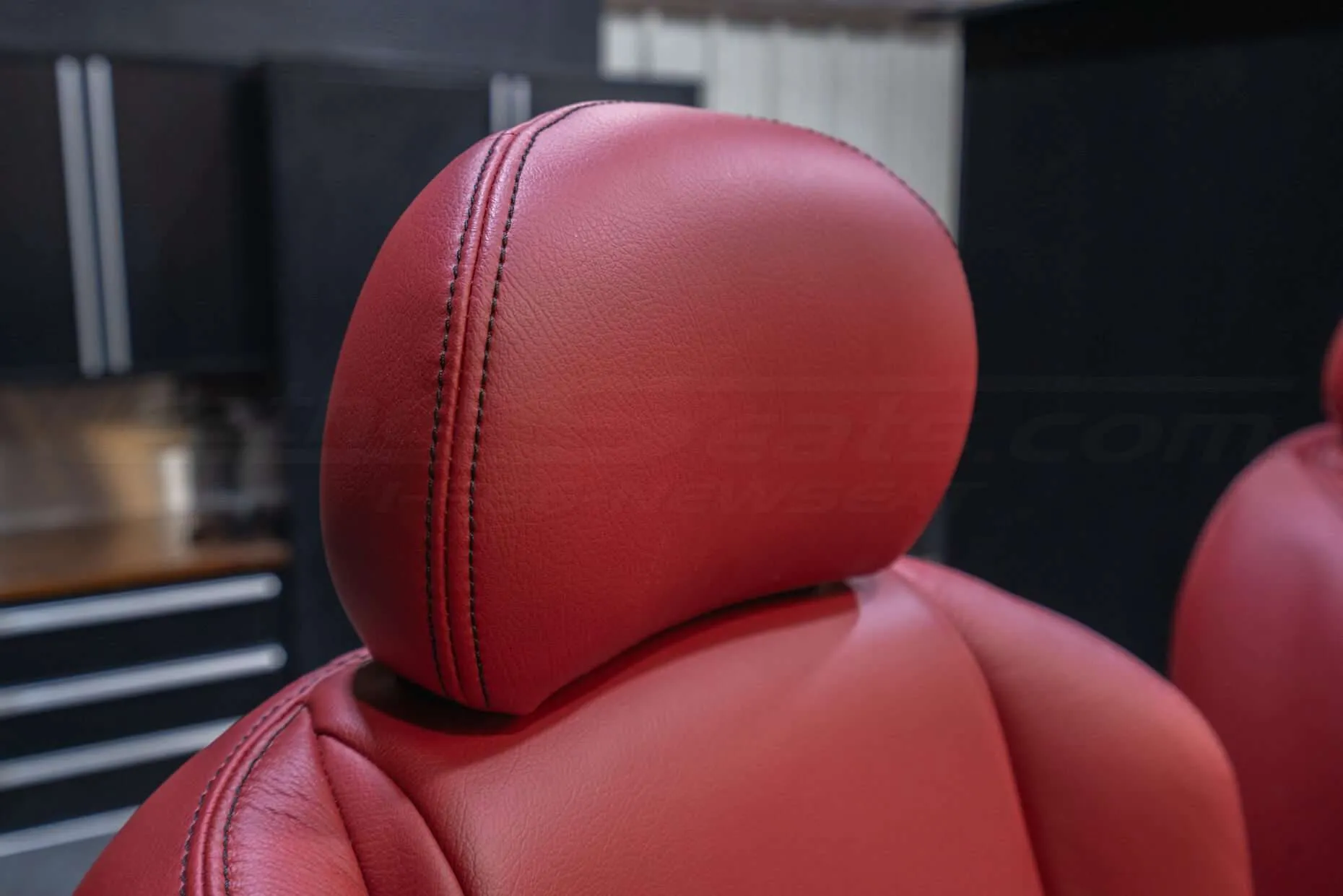Leather headrest close-up with contrasting Black stitching
