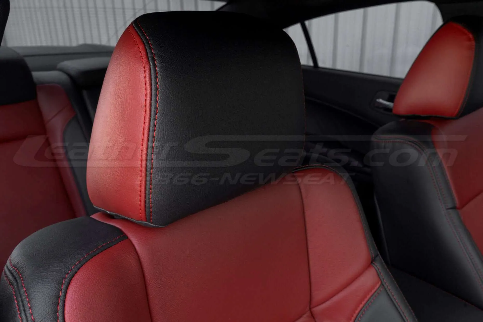 Two-tone leather headrest with contrasting Cardinal stitching