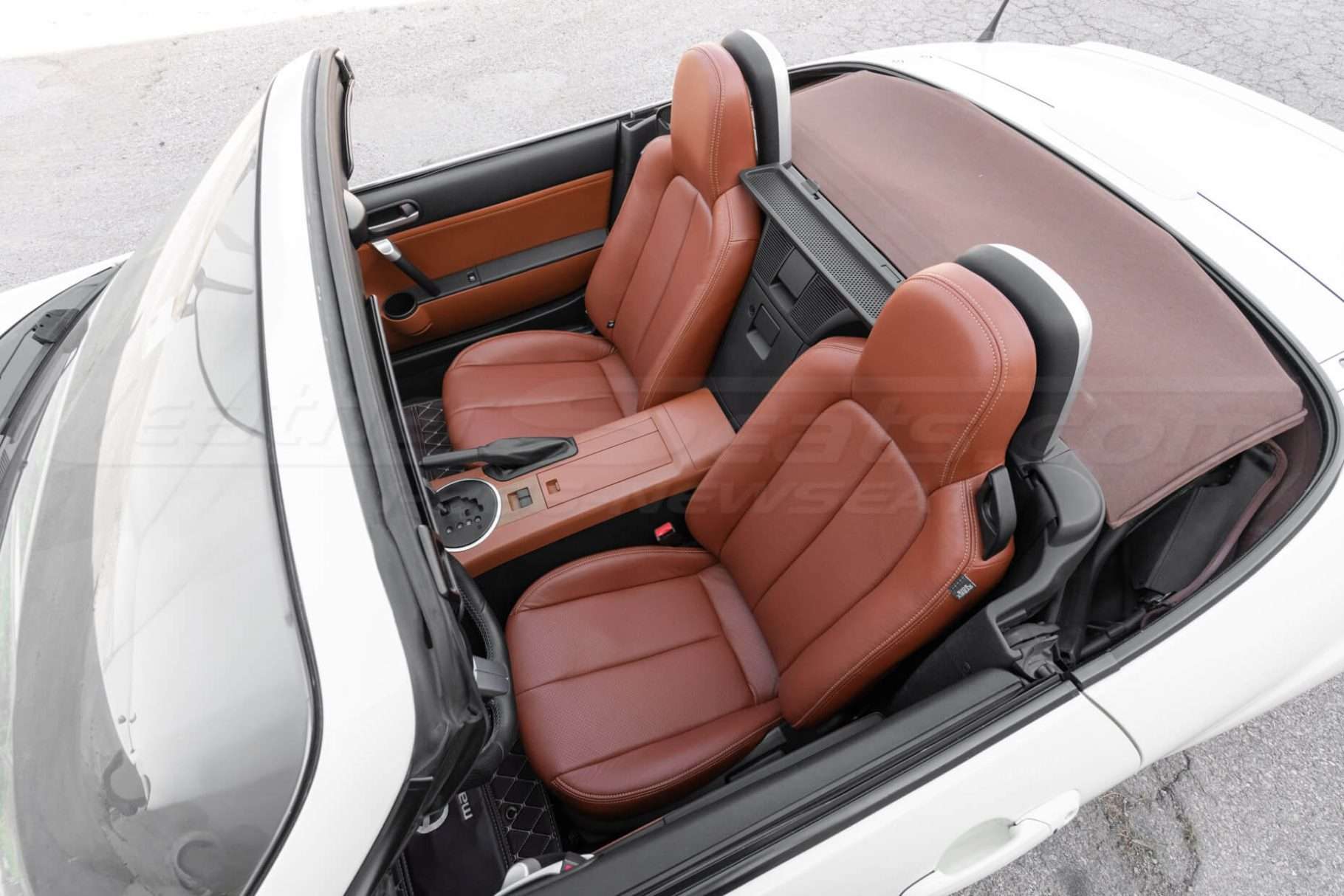 Top-down convertible view of Mazda Miata Roadster with installed Mitt Brown leather seats
