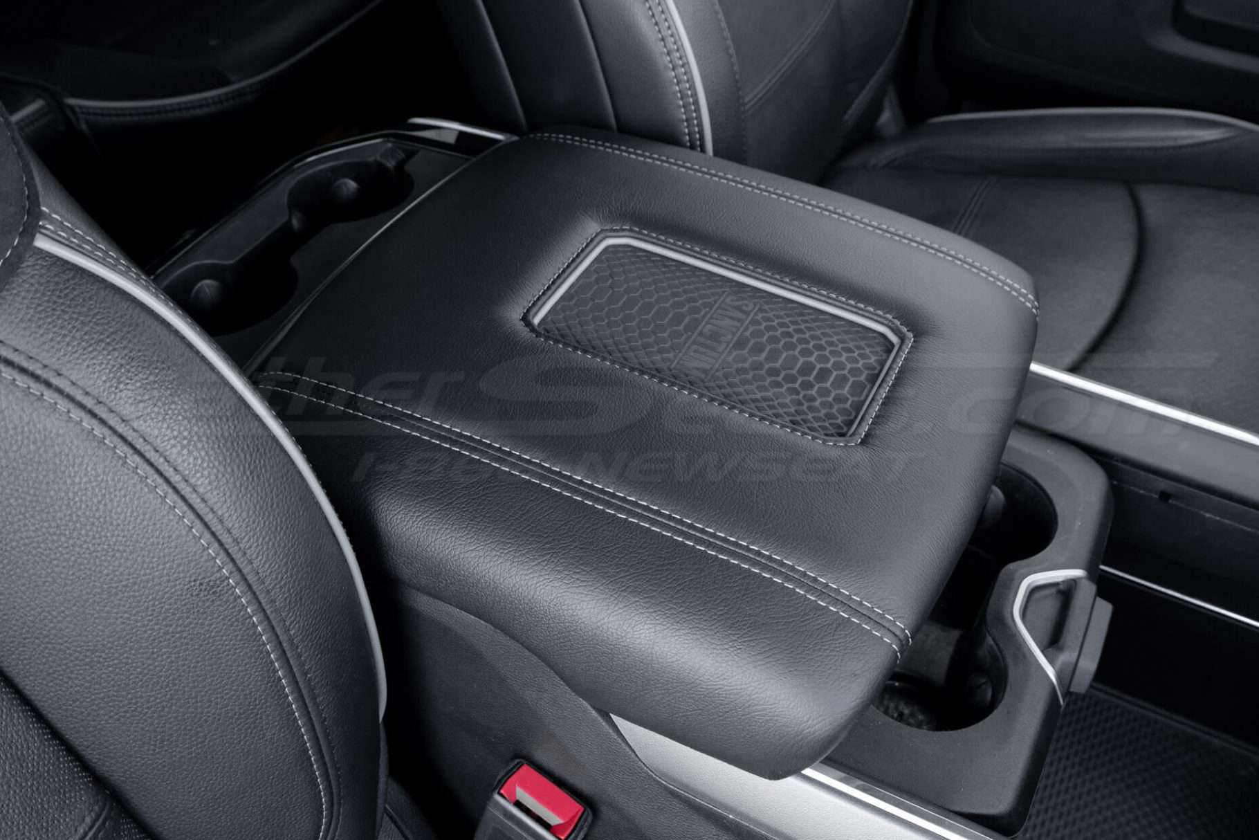 Passenger side view of Dodge Ram wireless charging console lid