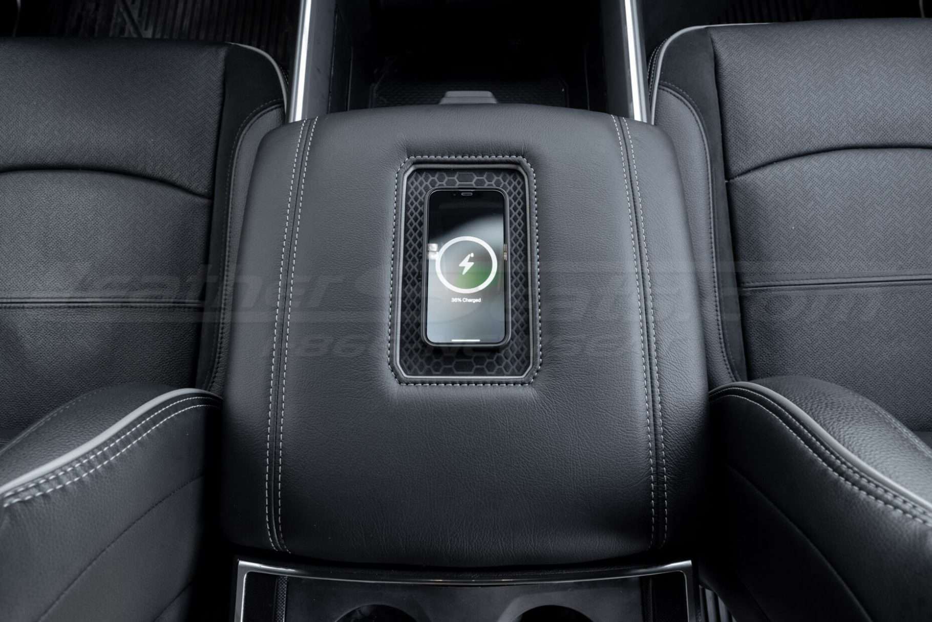 iPhone mini charging on wireless phone charging console
