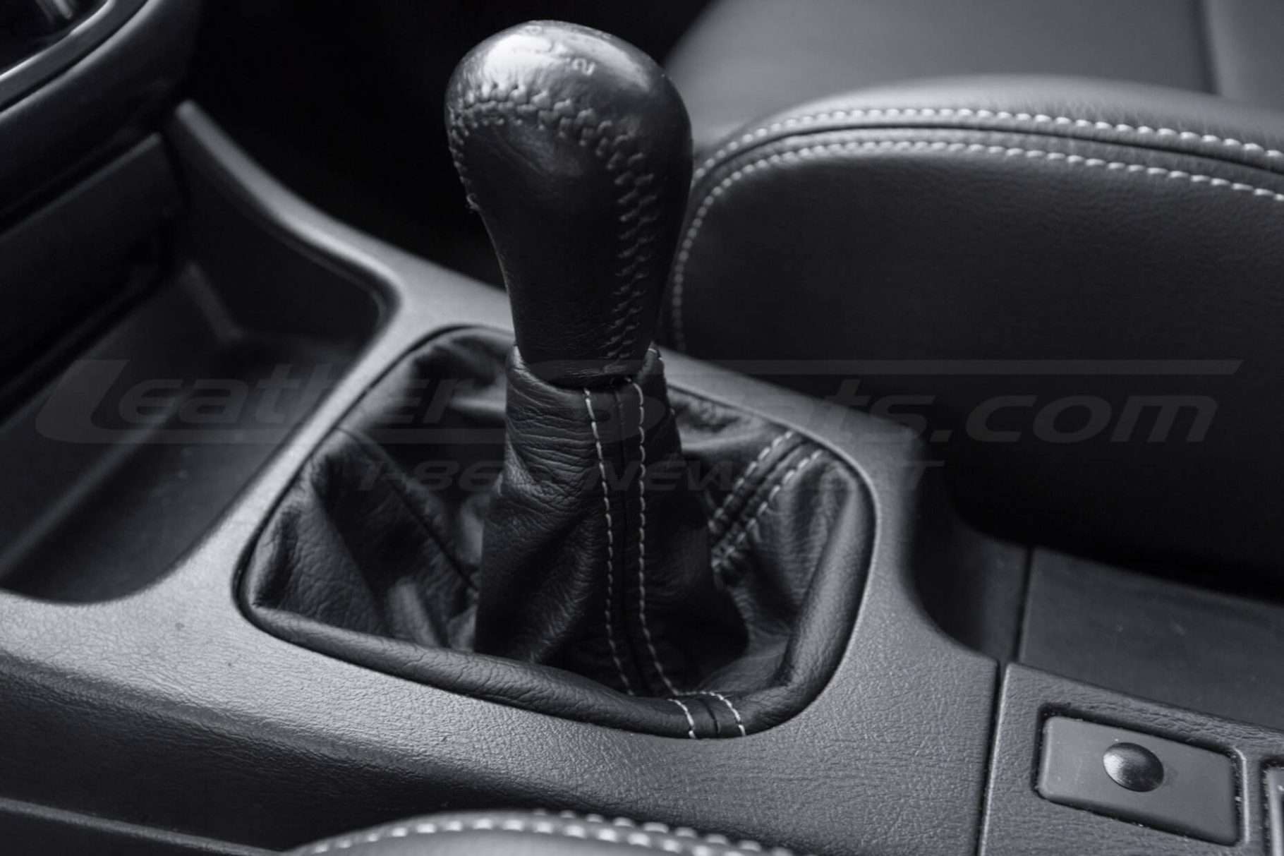 Black shift boot upholstery with contrasting stitching close-up