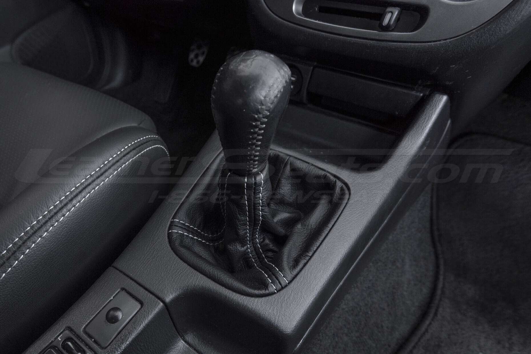 Black leather shift boot with contrasting double-stitching
