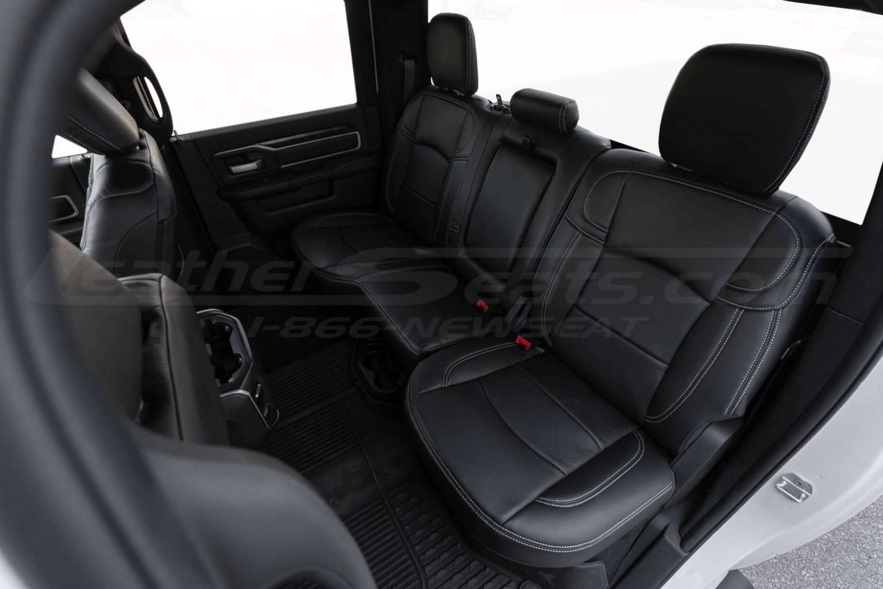 2019+ Dodge Ram with premium installed black leather seat covers - Rear seats from driver side