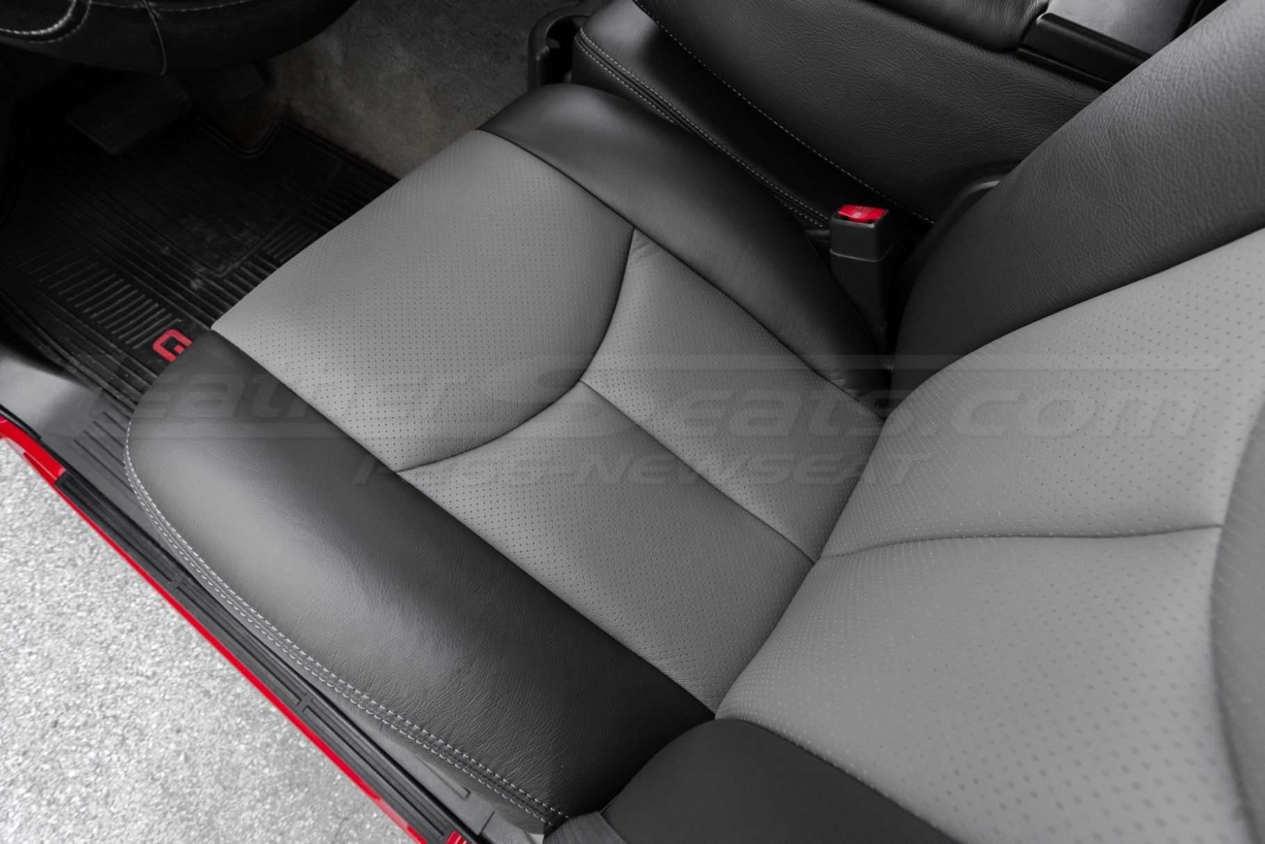 Top down view of front driver seat with Perforated Smoke Body sections