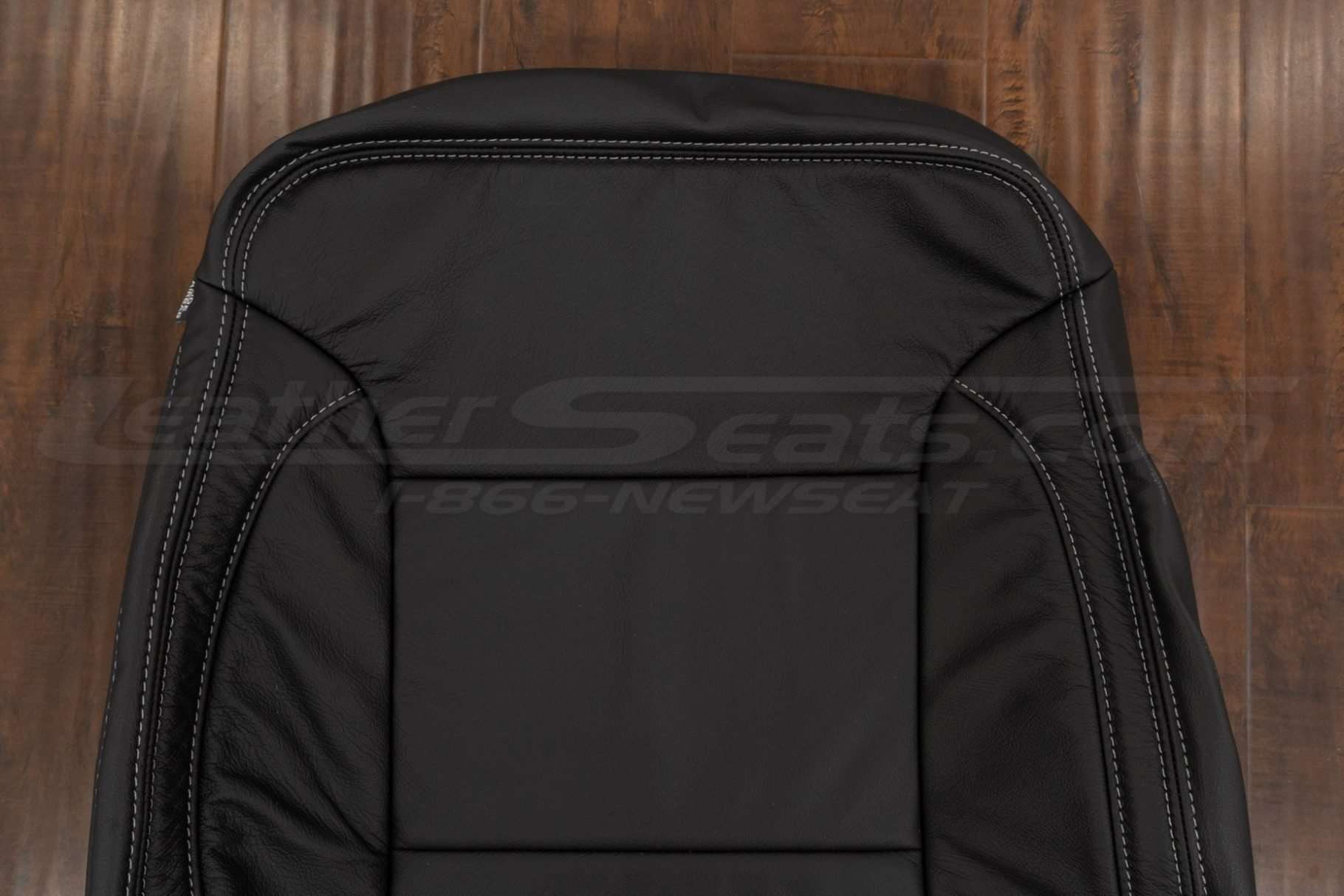 Upper section of front backrest upholstery