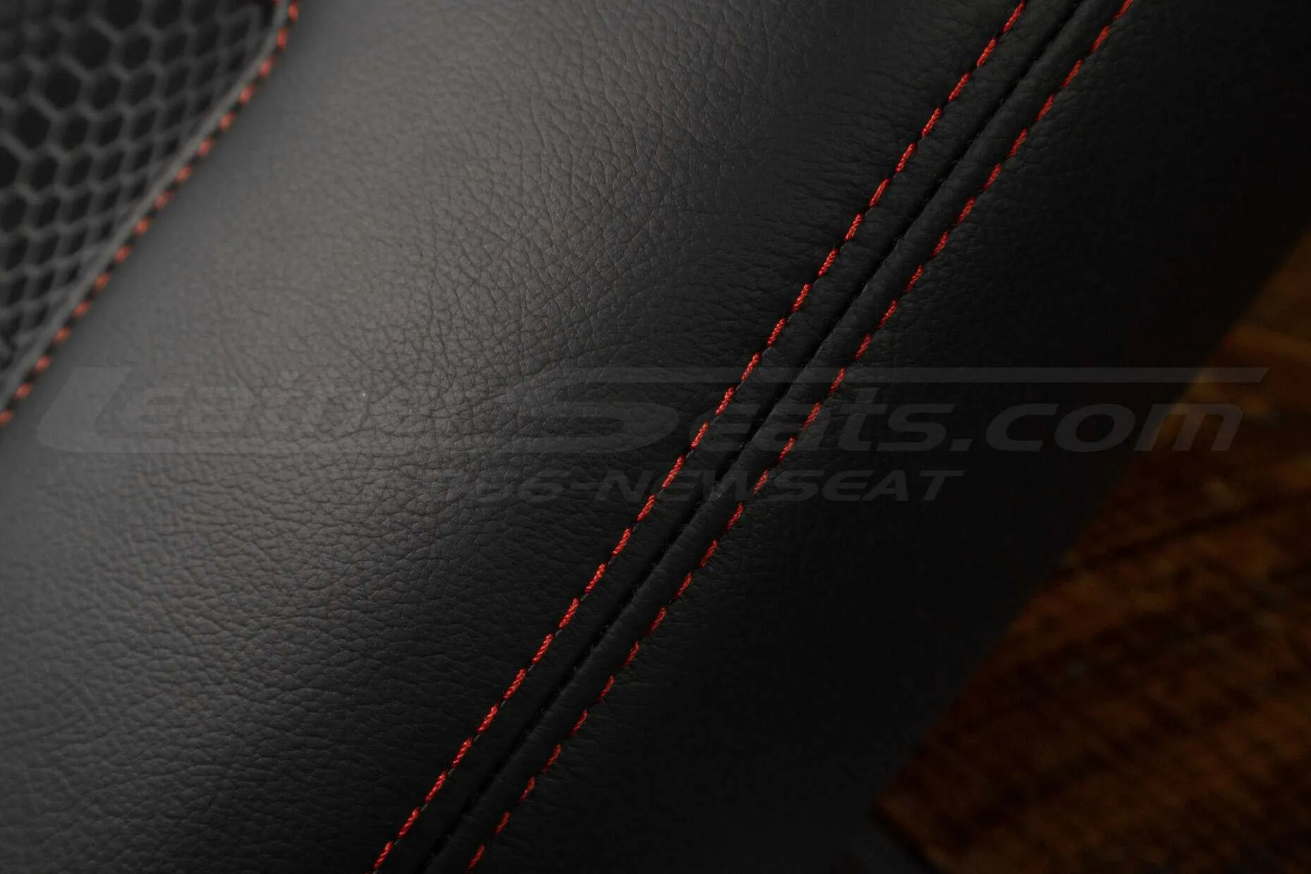 Contrasting Bright Red stitching on Black leather