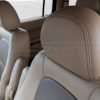 Installed leather headrest cover in Sandstone