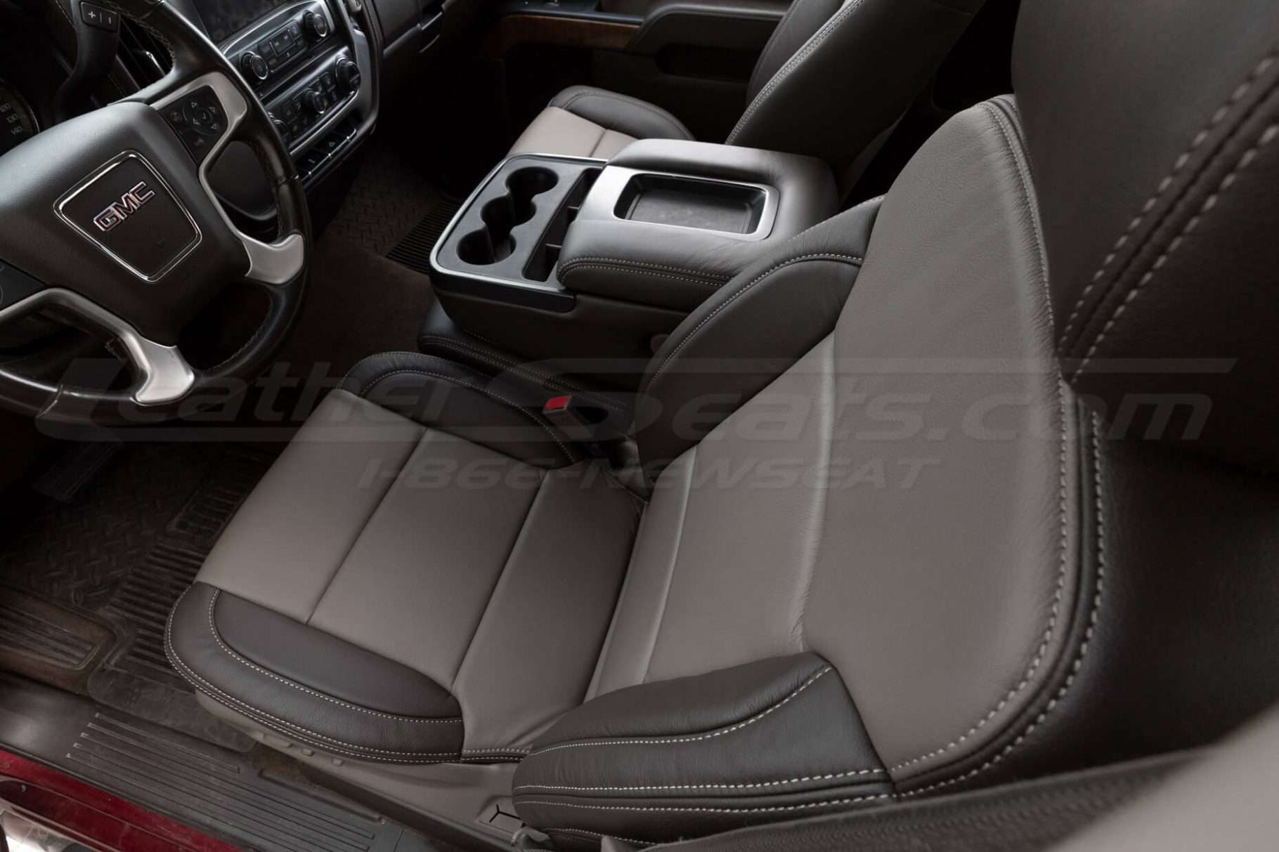 Top down view of front driver leather seat with coffee and bristol leather