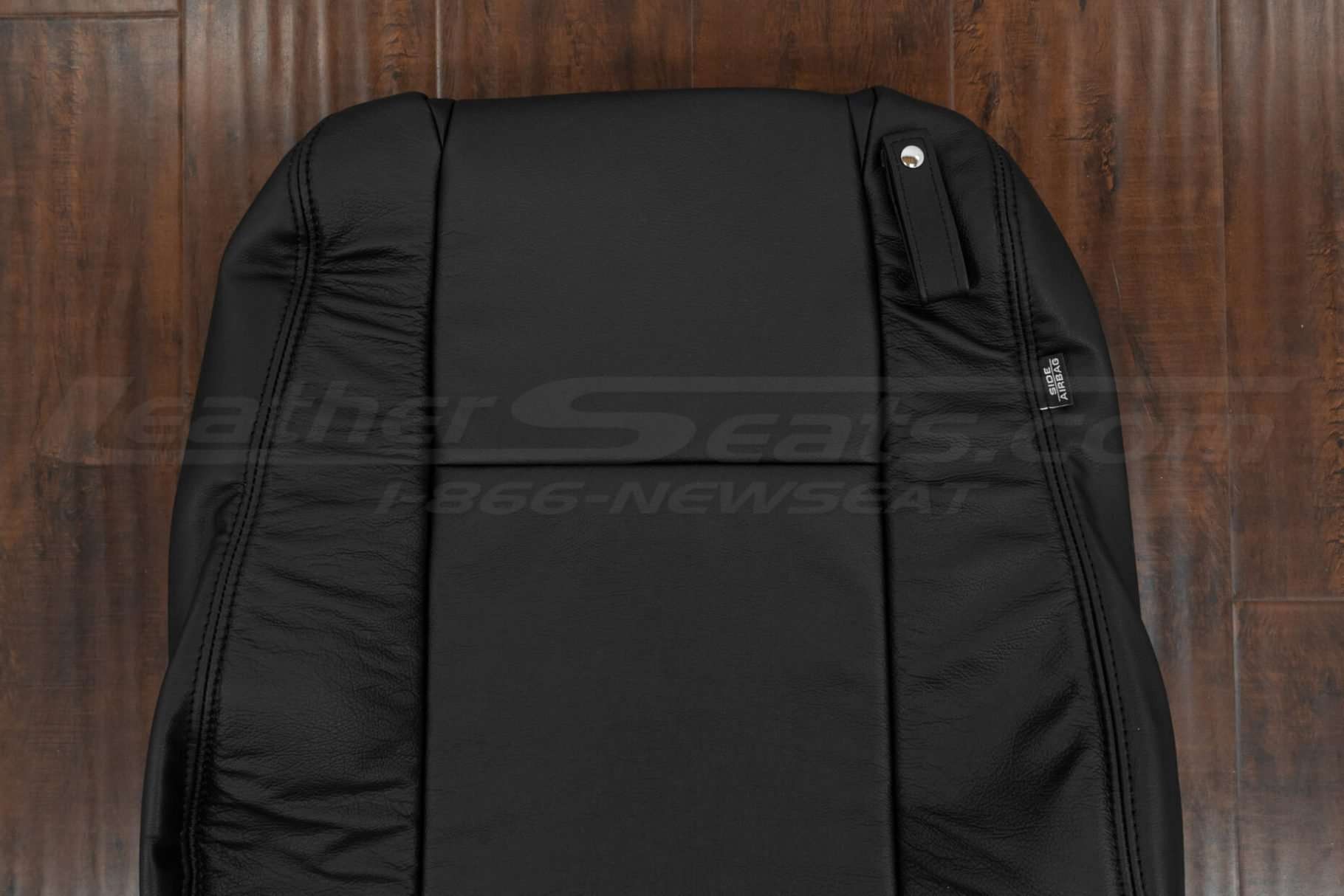 Upper section of front backrest upholstery