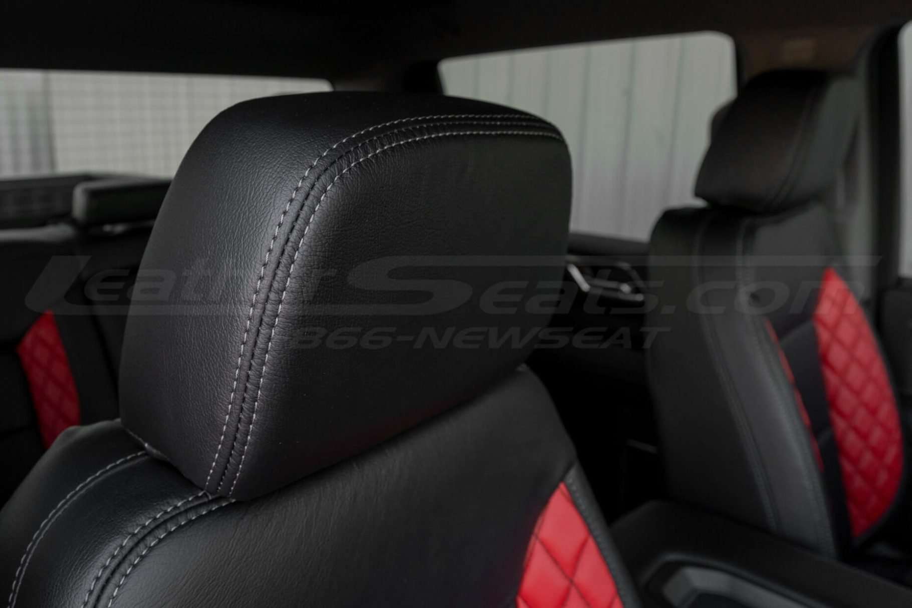 Installed headrust upholstery with contrasting Lapis stitching close-up