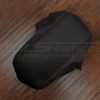 Top down side view of leather console upholstery with contrast stitching