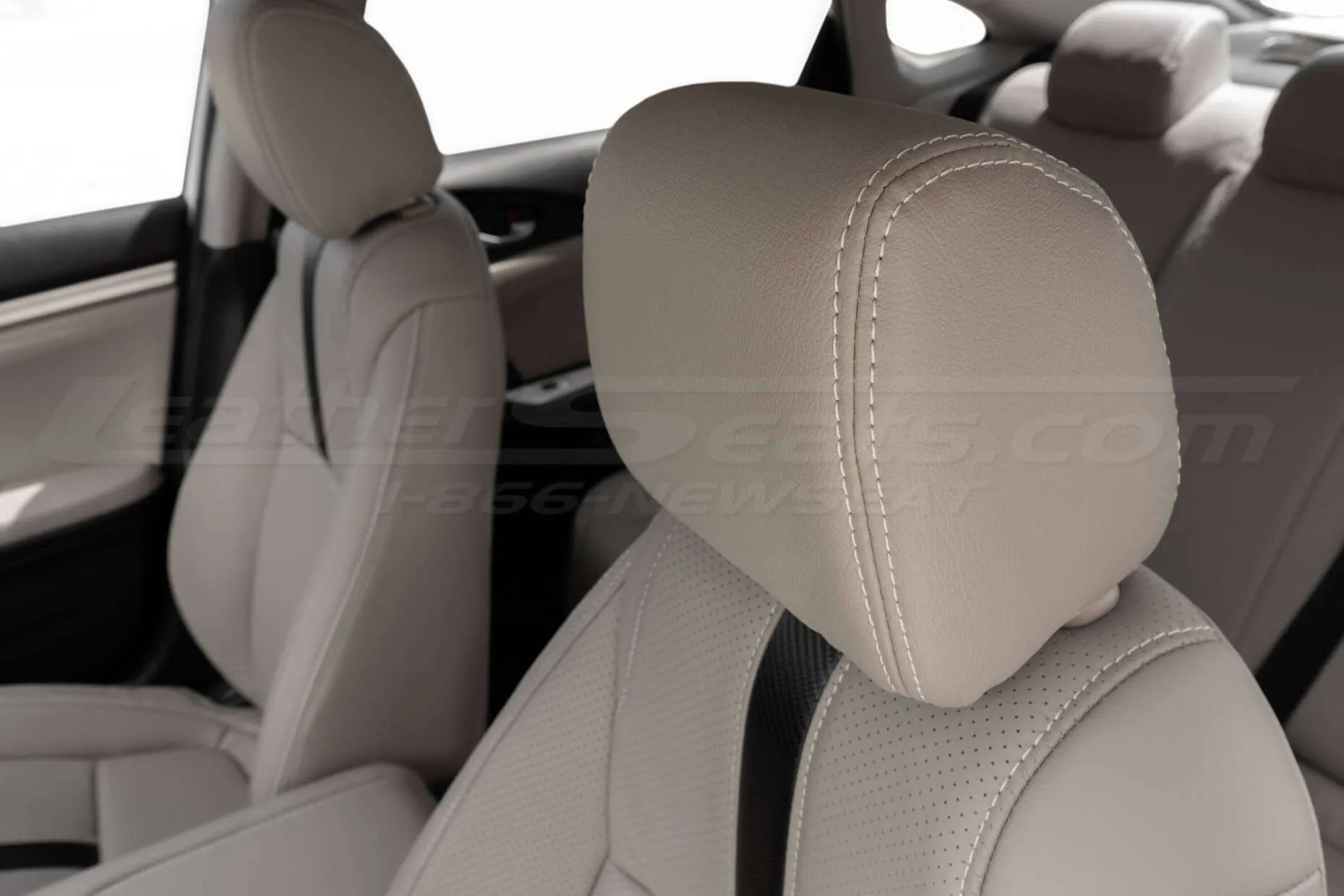 Honda Civic leather headrest close-up - Beach leather with contrasting Alabaster double-stitching