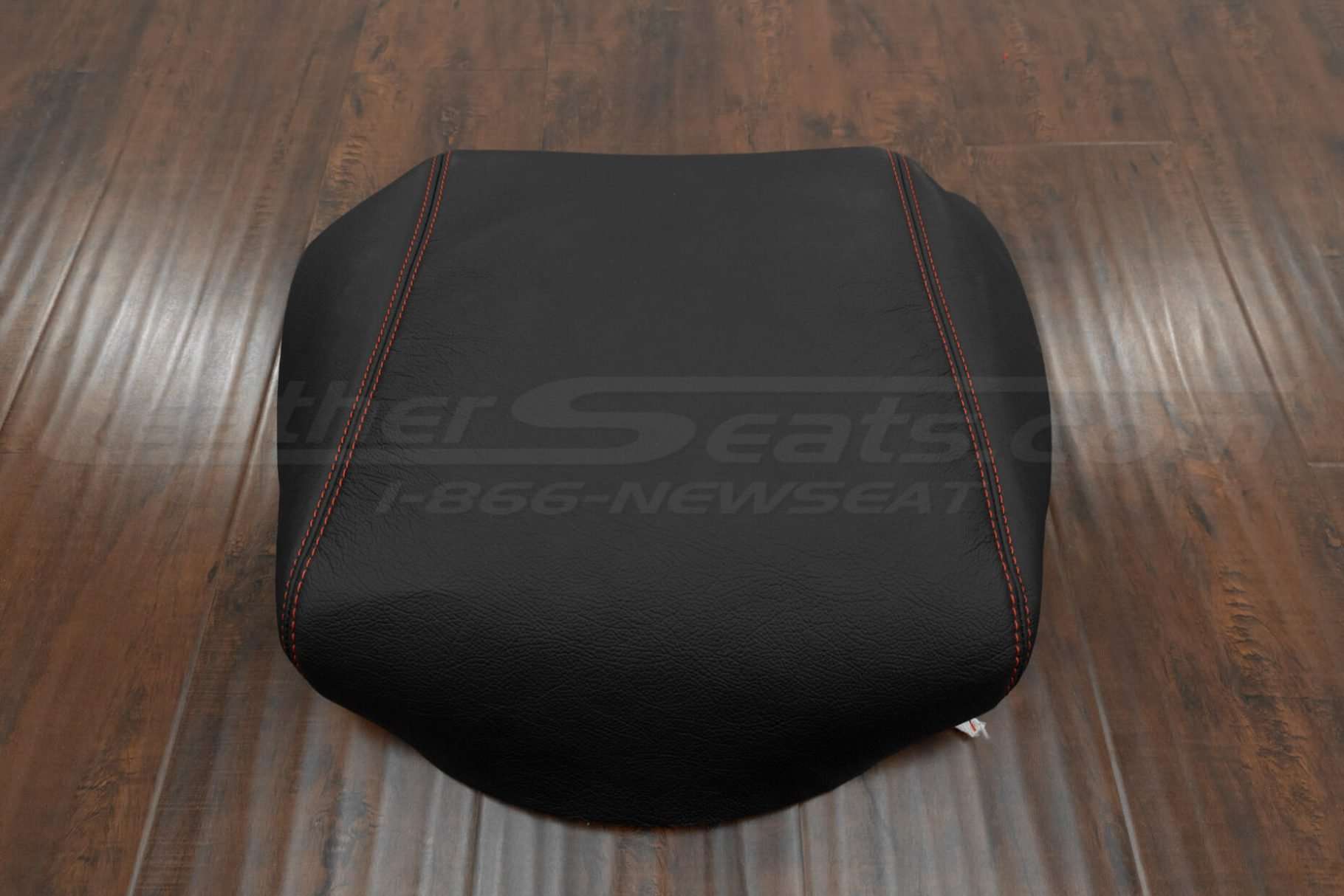 Black leather console lid upholstery with contrasting Red double stithcing