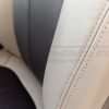 Matching Sandstone double-stitching on installed sandstone leather backrest