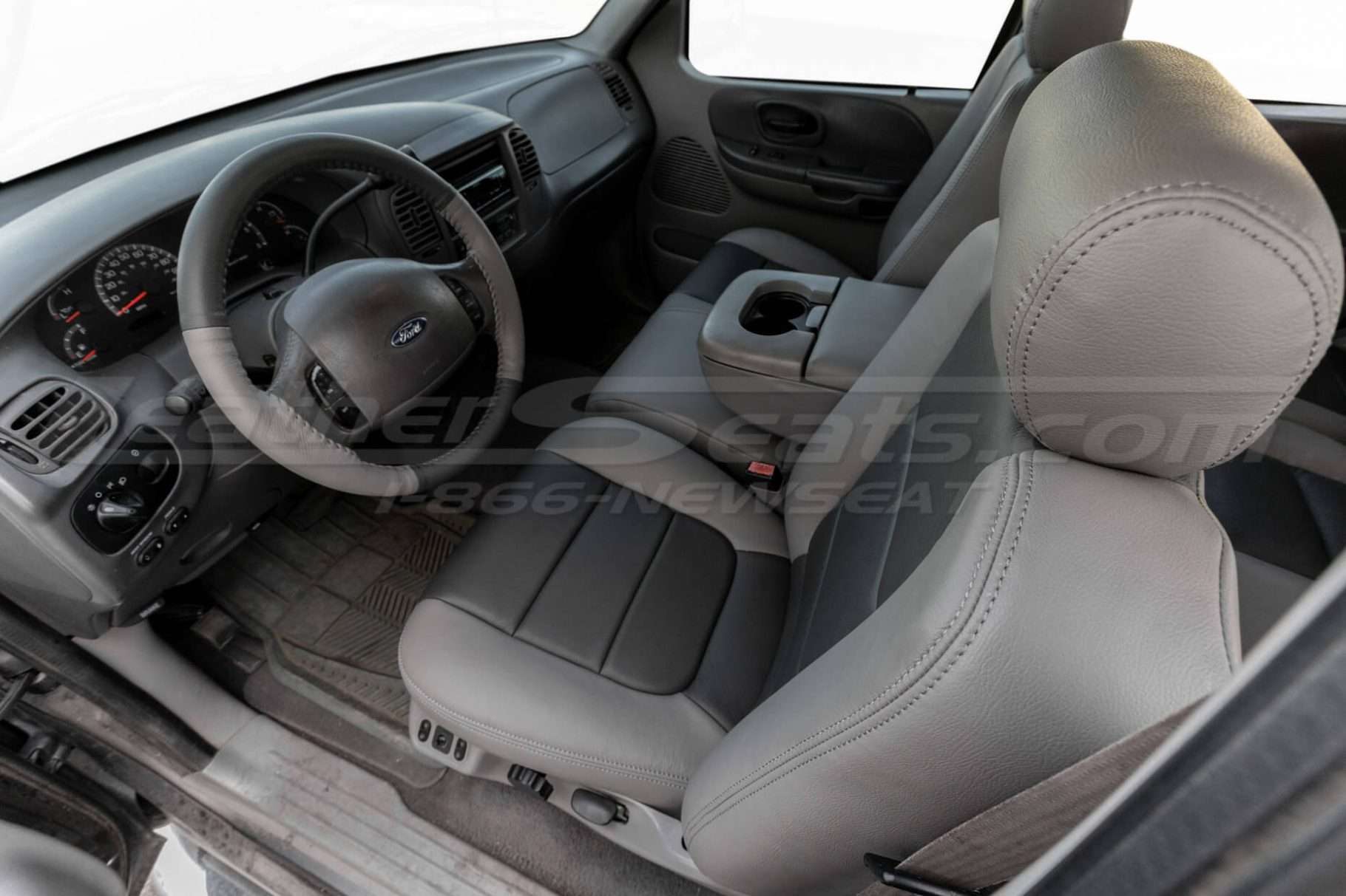 Top-down view of front driver seat with two-tone stone & graphite body