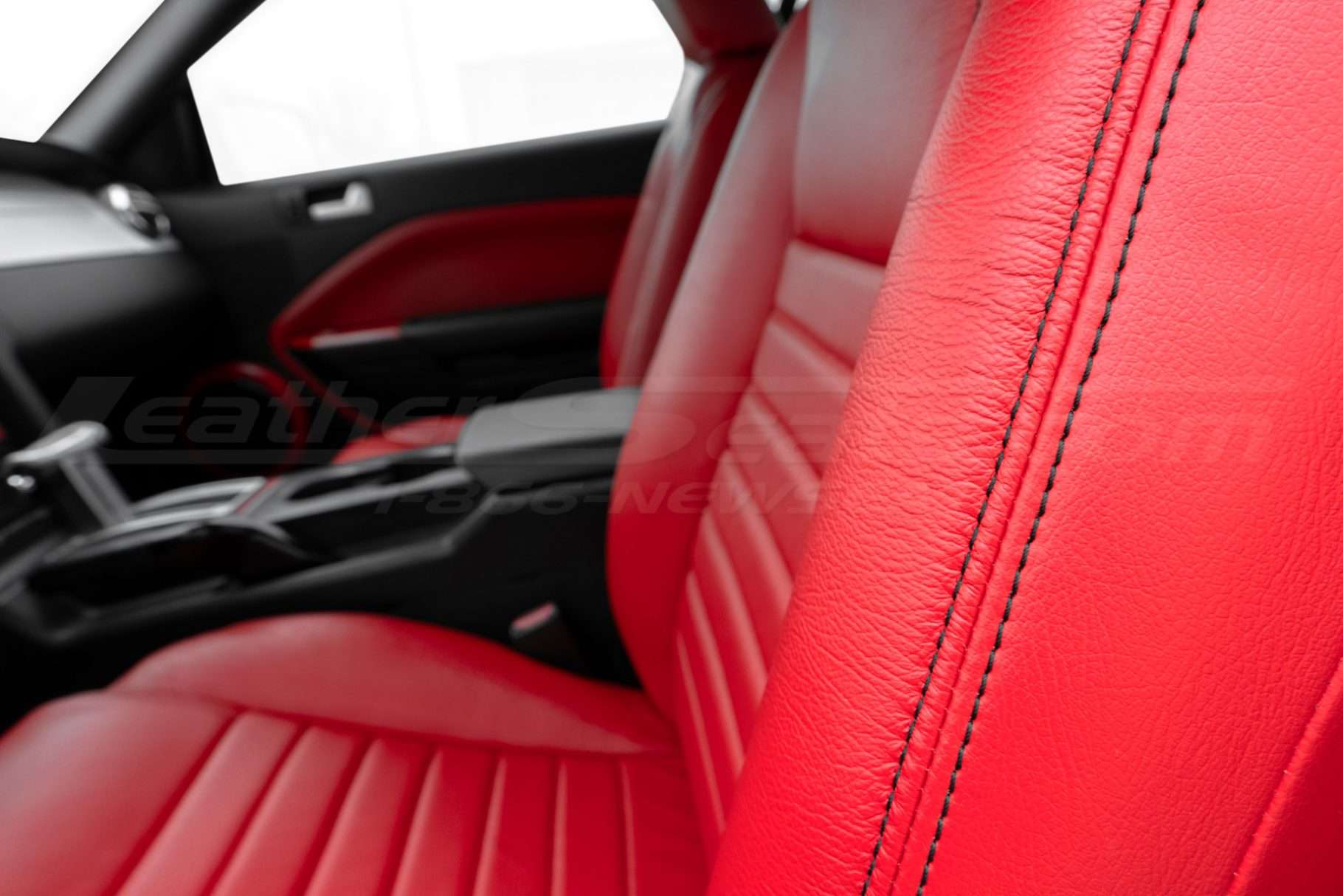 Contrasting double-stitching on Bright Red leather